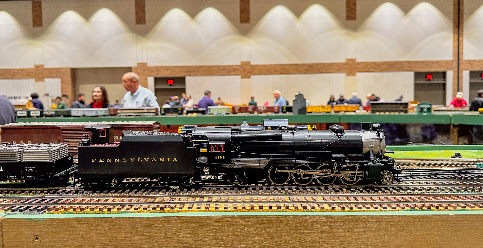 Detailed steam locomotive displayed on an operating model railroad layout at the DFW Train Show in Plano, Texas.